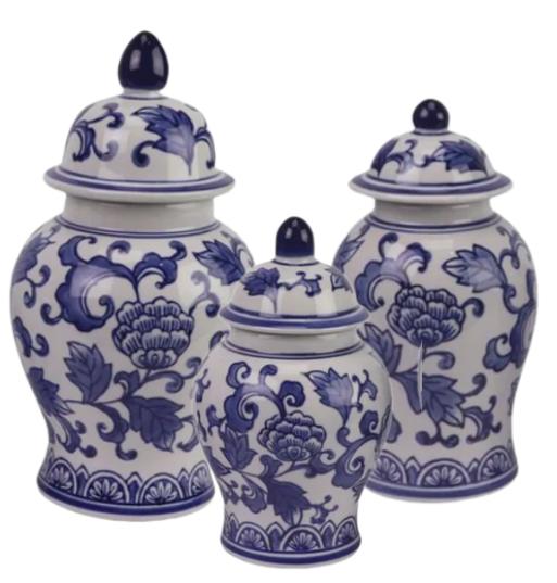 Set of three blue and white ceramic jars with floral patterns on a white background
