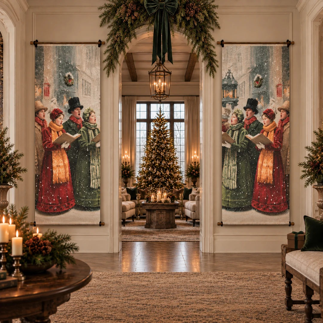 A large vertical wall tapestry banner featuring a vintage Christmas street scene with people singing in the snow, displayed on either side of a doorway in a beautifully decorated holiday living room with a Christmas tree and candles.