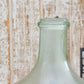 Clear glass bottle with a rustic wooden background