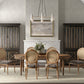 Dining room with wooden table and chairs, large windows, and a fireplace.