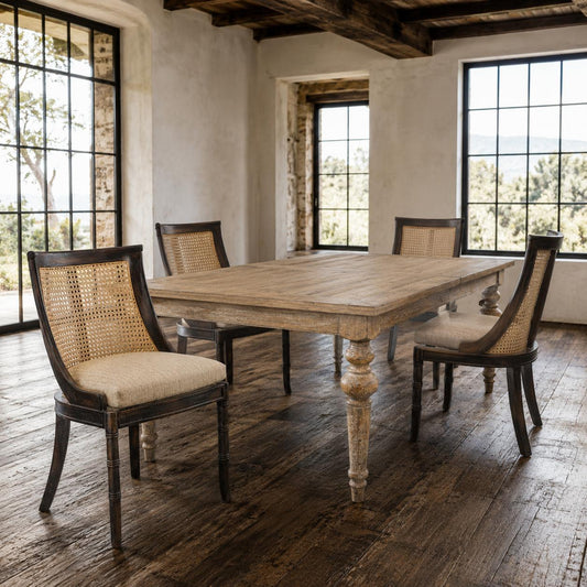 Dining room with wooden table and chairs in a rustic setting
