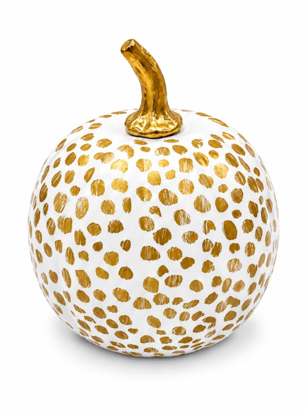 A decorative ceramic pumpkin with a white body covered in hand-painted gold polka dots and a textured gold stem, shown on a clean white background.