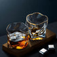 Two glass tumblers with a dark background