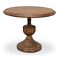 Round wooden table with decorative pedestal base on a white background
