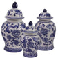 Set of three blue and white ceramic jars with floral patterns on a white background