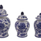 Set of three blue and white ceramic jars with floral designs on a white background