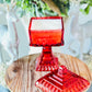 red glass candle